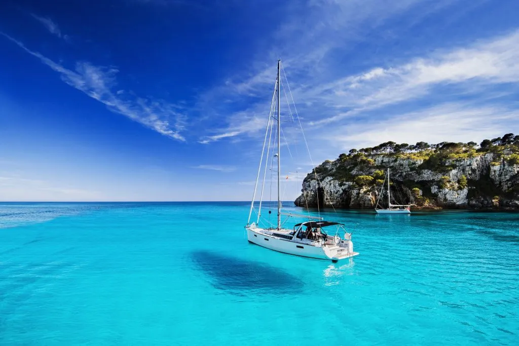Beautiful bay with sailing boats Beautiful bay with sailing boats, Menorca island, Spain